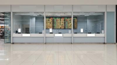 Clean exchange-house counter inside a hypermarket retail concourse
