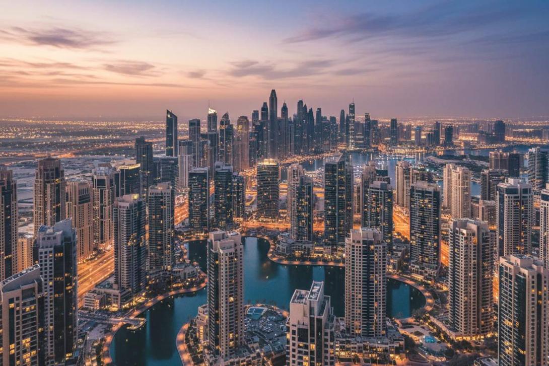 Aerial dusk view of Jumeirah Lakes Towers (JLT) with 67 high-rise towers around four artificial blue lakes