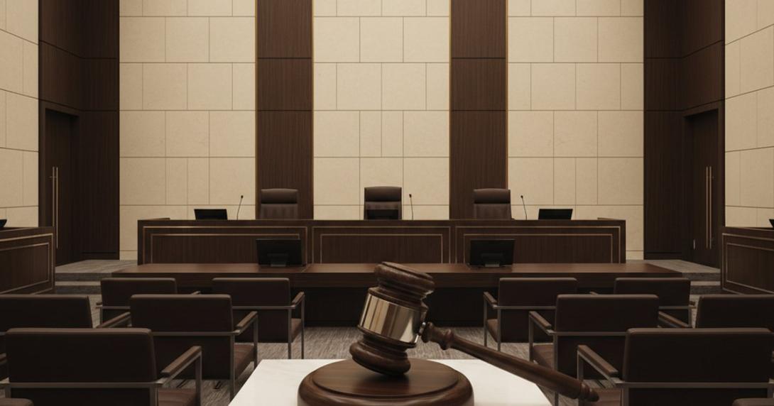 Modern courtroom-style hearing chamber in Dubai with polished wooden bench and Arab-Islamic geometric wall panelling