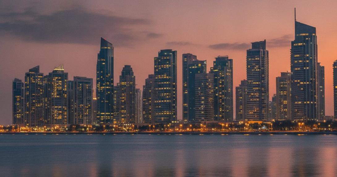 Abu Dhabi Corniche residential towers at dusk seen from the water